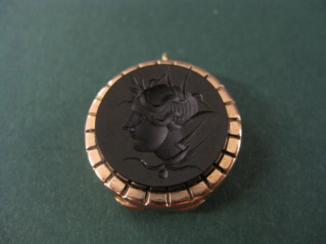 Victorian 14k Locket with Intaglio cut black onyx: cut black onyx, bust of a soldier, rose gold, circa 1880.