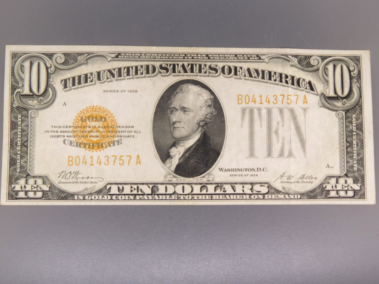 1929 $10.00 Gold Certificate, Hamilton,: signed by Woods-Mellon, appears extra fine.