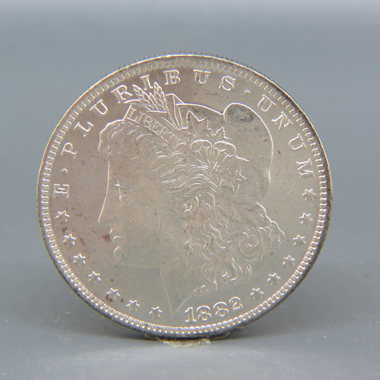 1882-O Morgan Silver Dollar, uncirculated, (1 of 2)