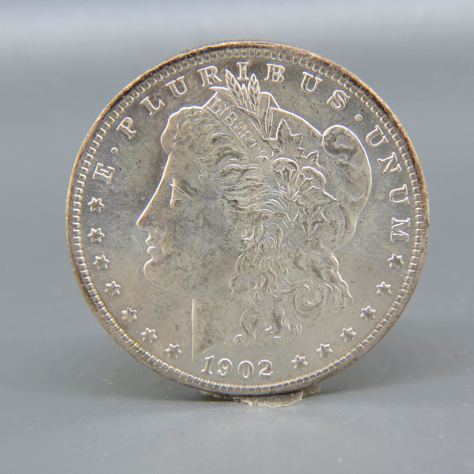 1902-O Morgan Silver Dollar, uncirculated, (1 of 2)