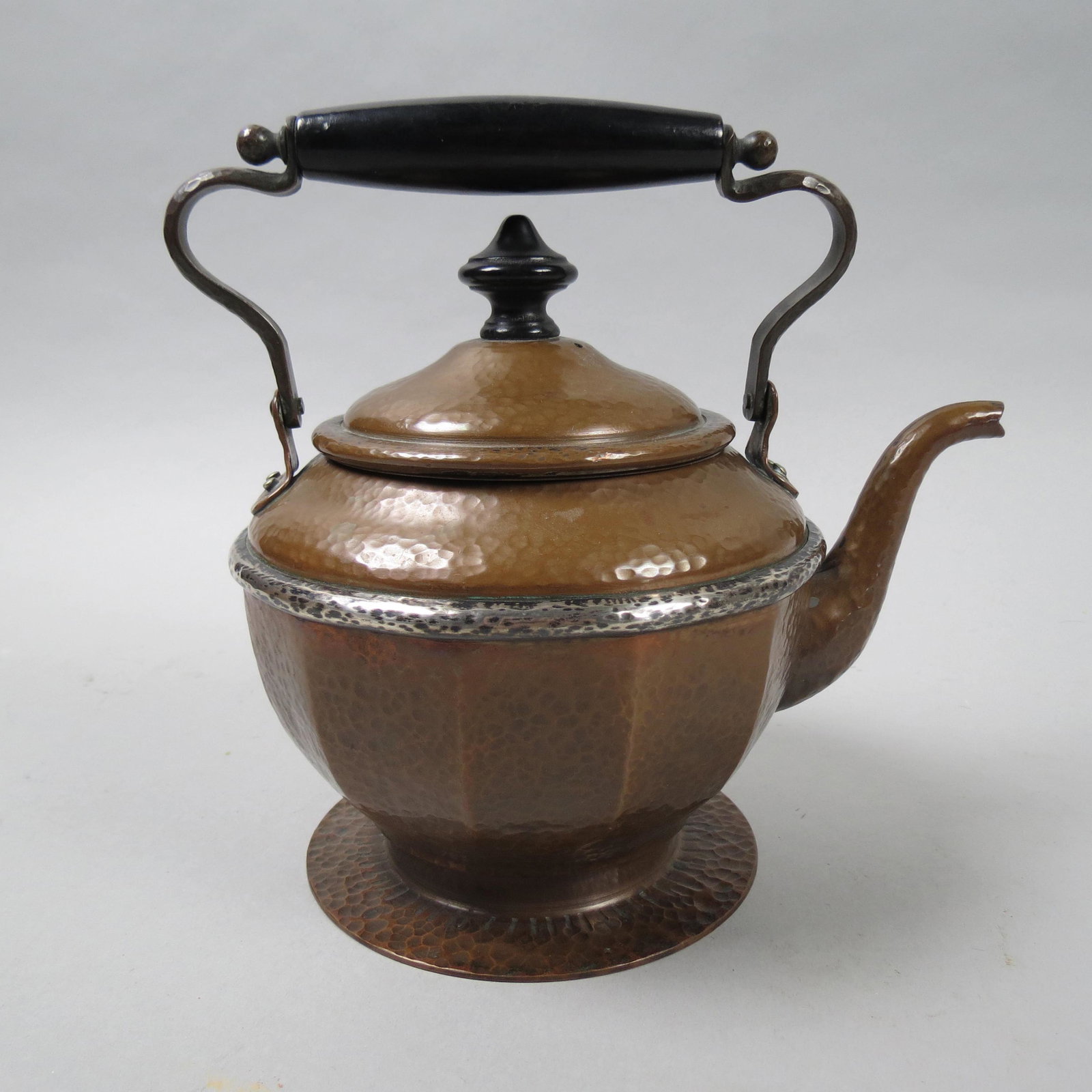 Joseph Heinrichs Copper & Silver Teapot: Famous Arts & Crafts maker of New York and Paris, hand hammered copper with silver band, silver interior, 7 tall plus swing handle, signed, excellent.