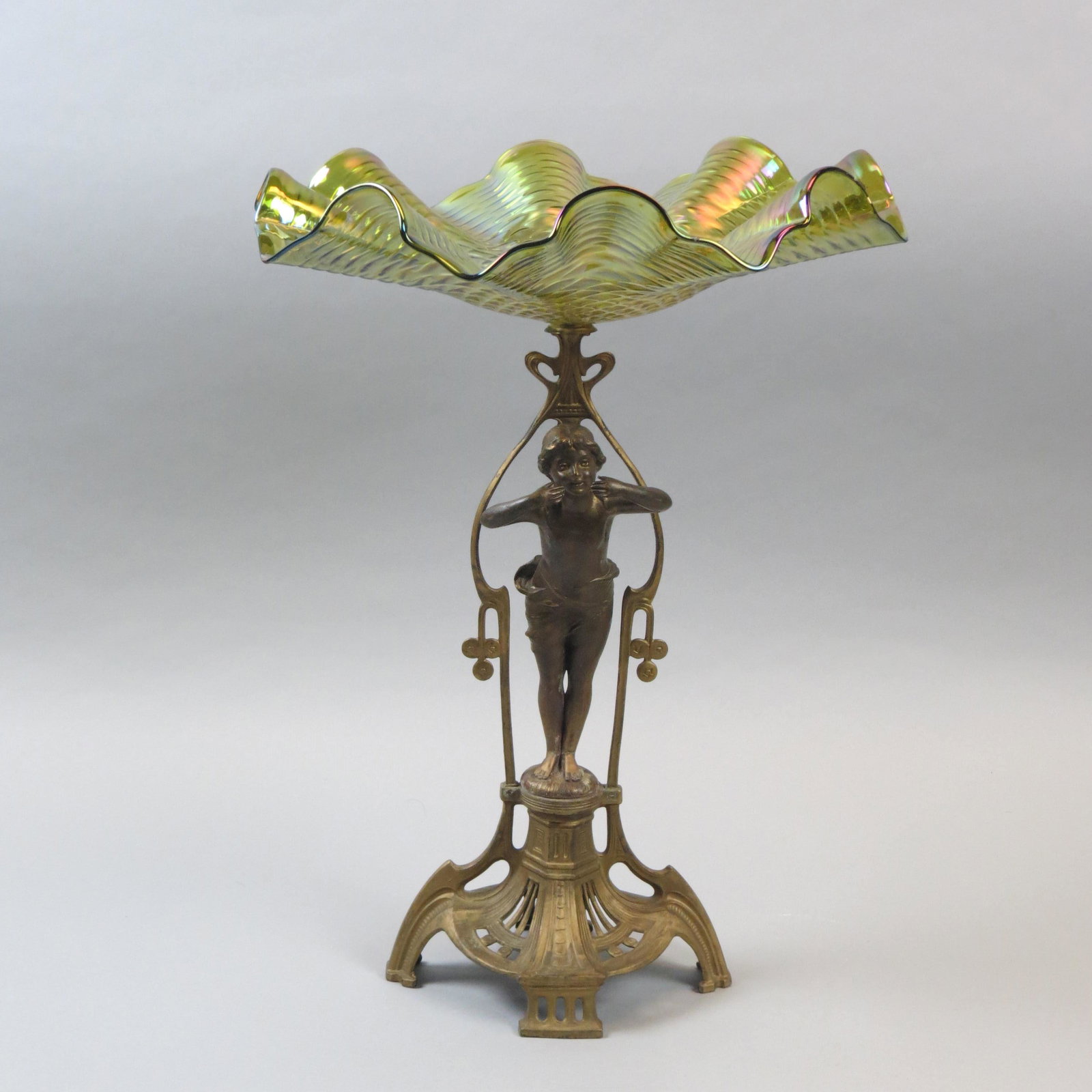 Art Nouveau Bronze & Art Glass Centerpiece: 13 Diameter Loetz type green iridescent bowl on figural stand with semi-nude female, 18 1/2" tall, circa 1890.