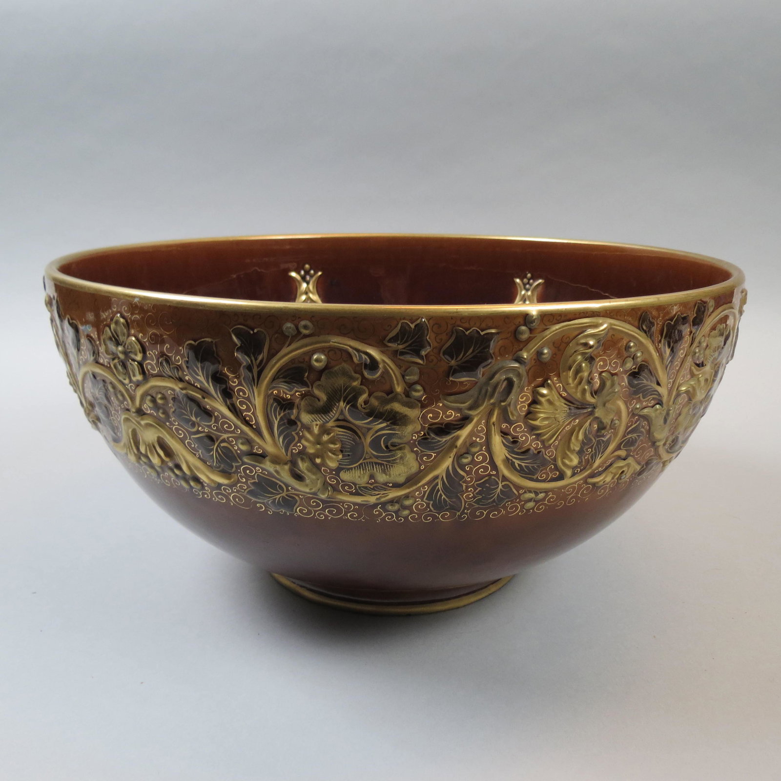 Luneville French Porcelain Punchbowl: Raised gold berry and vine decor on rich brown field, 14 1/2 diameter, 7 1/2" deep, circa 1900, hairline.