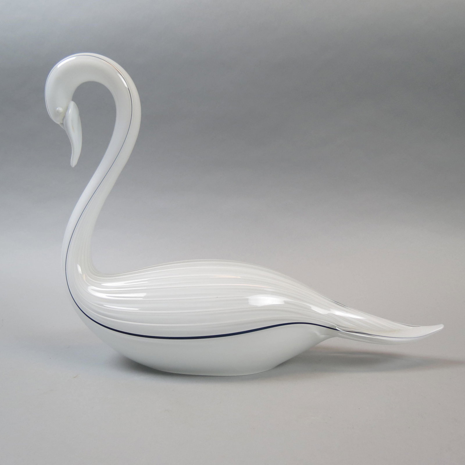 Livio Seguso Art Glass Swan Sculpture: White with white and black threaded design on ribbed body, 11 tall, 14 1/2" long, signed, excellent.........Born in Murano in 1930. Sculptor of glass, he started in the glassworks at a very early agea