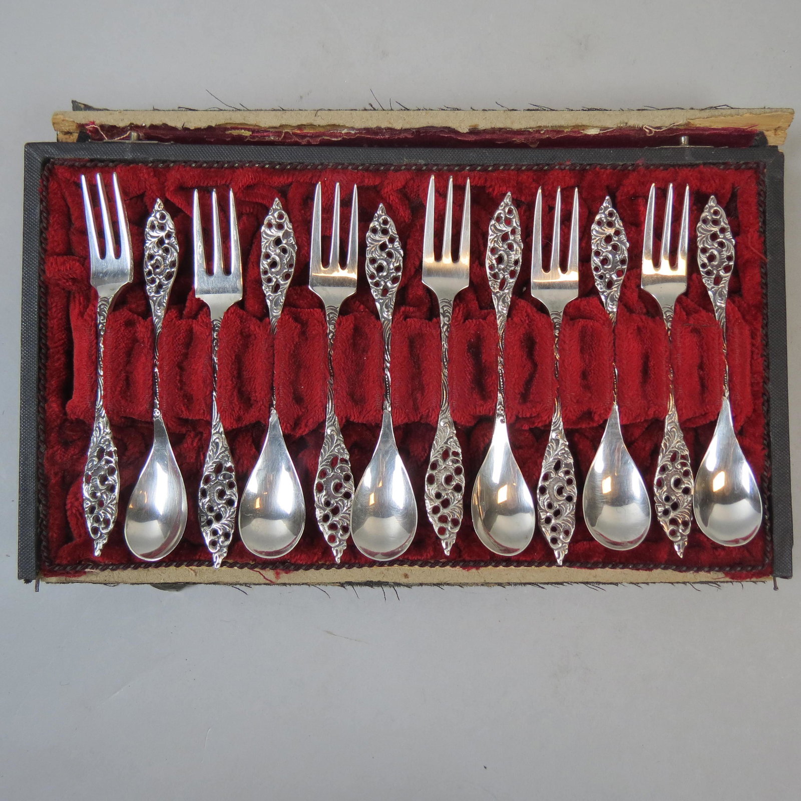 European Silver Dessert Service for 6: Includes six ice cream spoons and six cake forks, 4 1/2, fancy rococo openwork, hallmarks, no monograms, excellent, in original case, 119 grams.