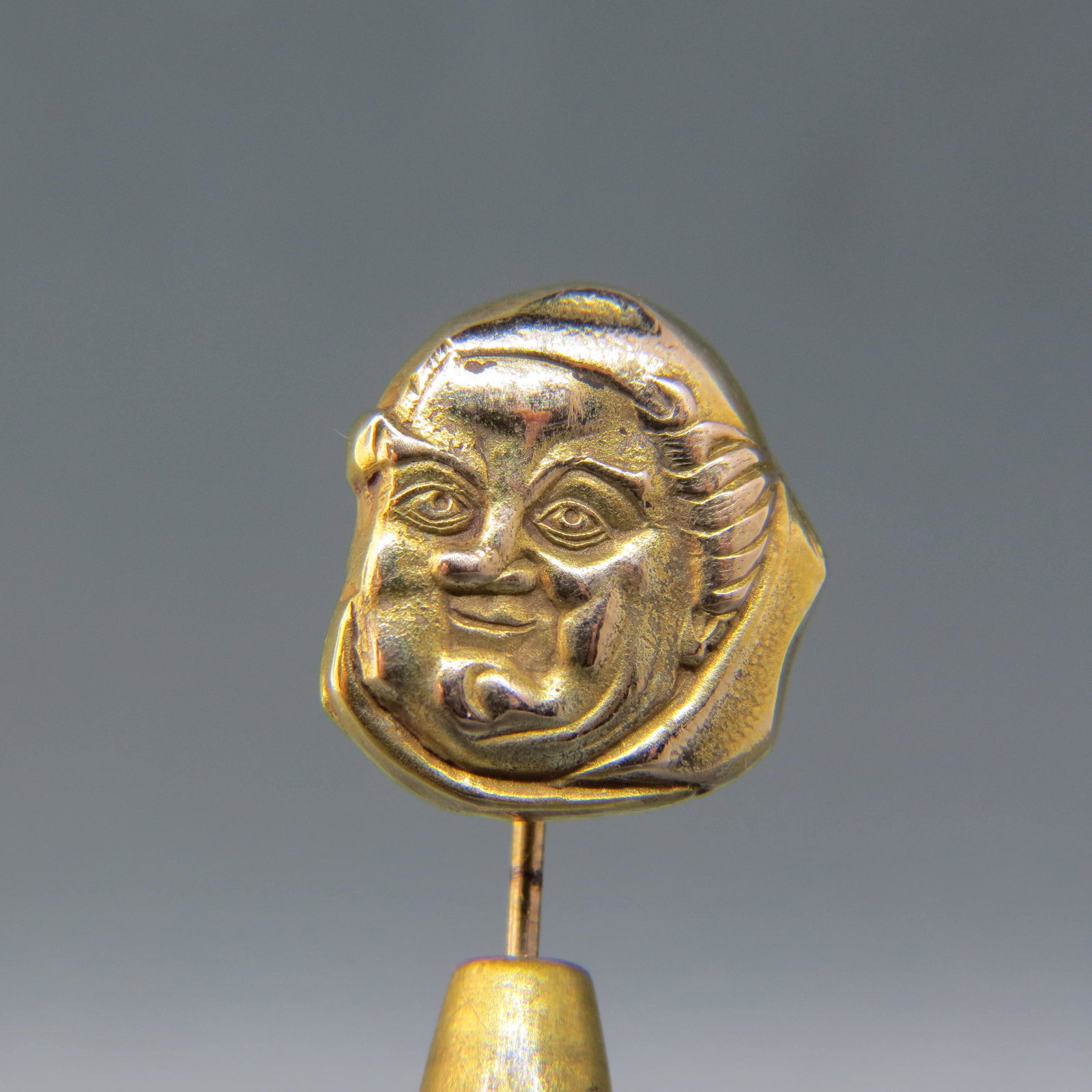 14K Gold Stickpin of a Monk: Yellow gold, 1/2' diameter, 2 1/4 long, 1.5 grams, circa 1890.