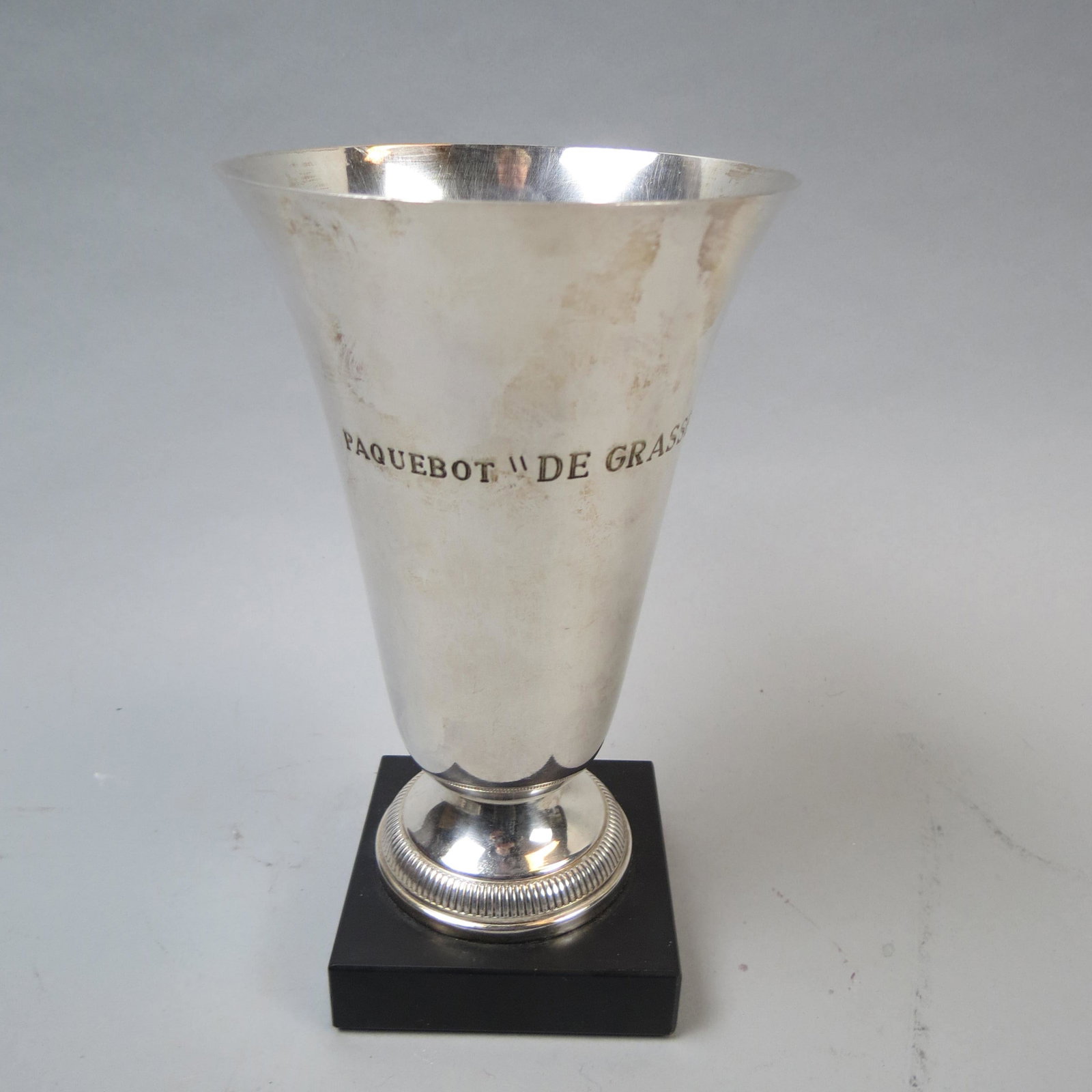 French Silverplate Steamship Vase De Grasse",": Famous ship, circa 1920's, black base, 7'.