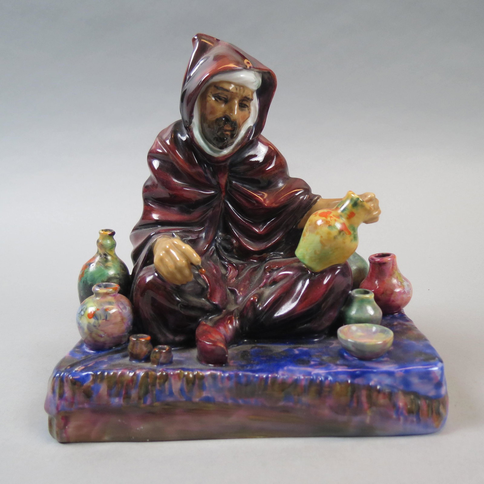 Royal Doulton Figurine The Potter",": HN1498, seated artist with his wares, 7, early mark, excelent.