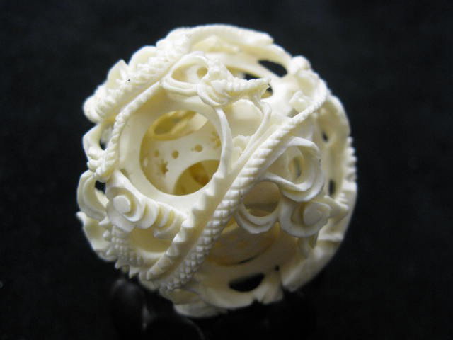 Carved Ivory Mystery Ball,: 7 inner balls, dragon decor, 1 3/4" diameter, some loss.