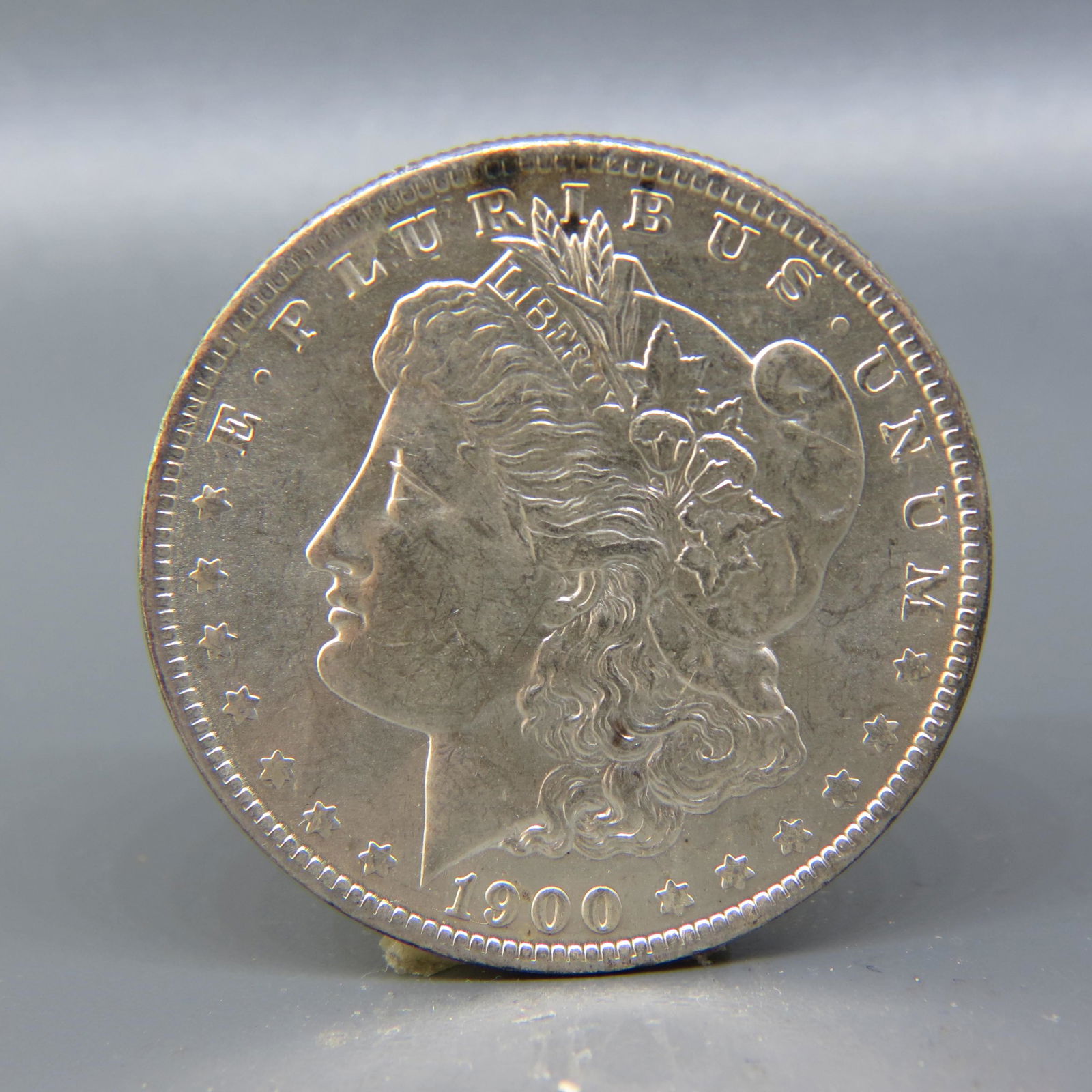 1900-O Morgan Silver Dollar,: uncirculated.