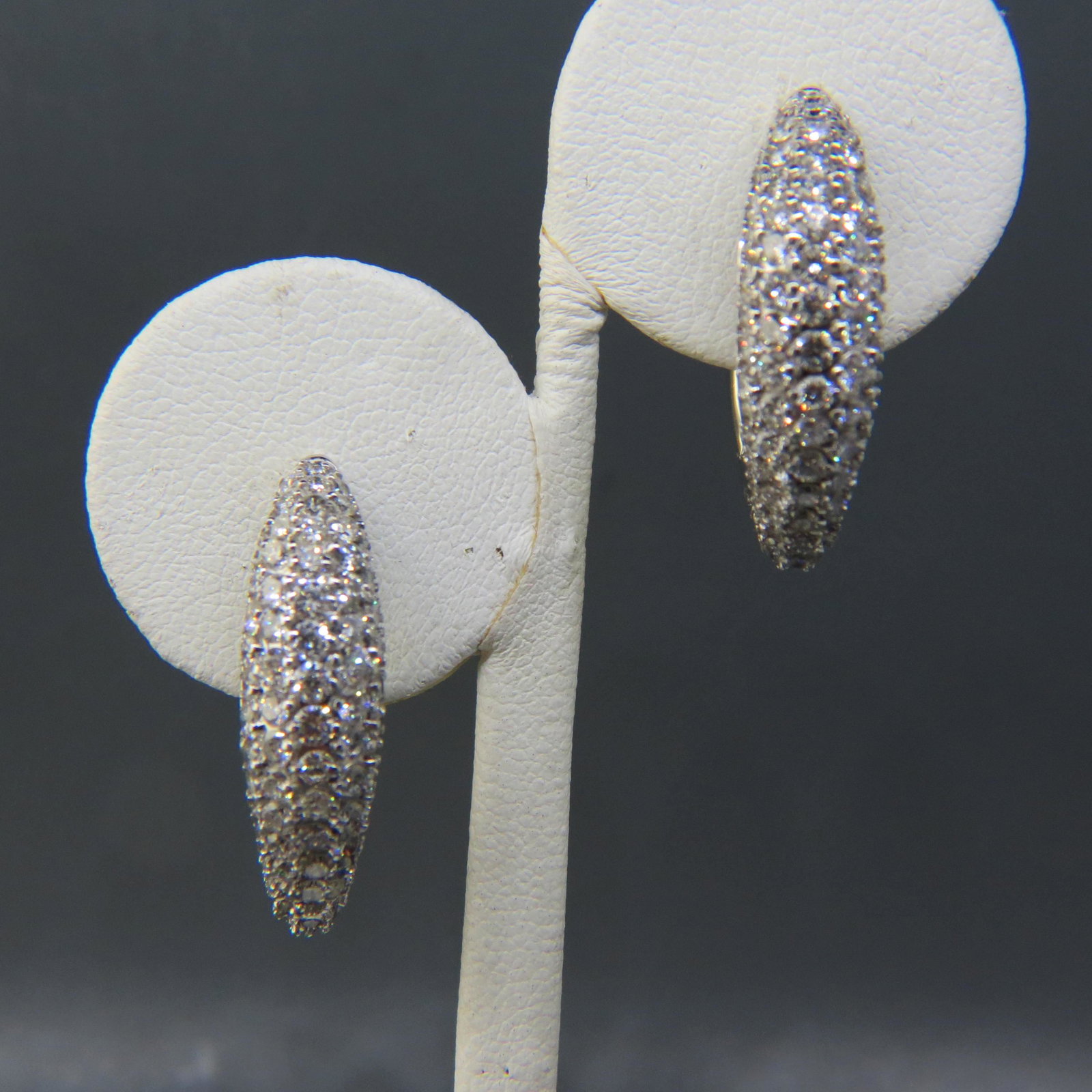Diamond Earrings 14K White Gold 5.50 carats,: 180 round diamonds in fancy hinged oval type hoops, beautifully made, with appraisal of $11,350.00, 1" long.
