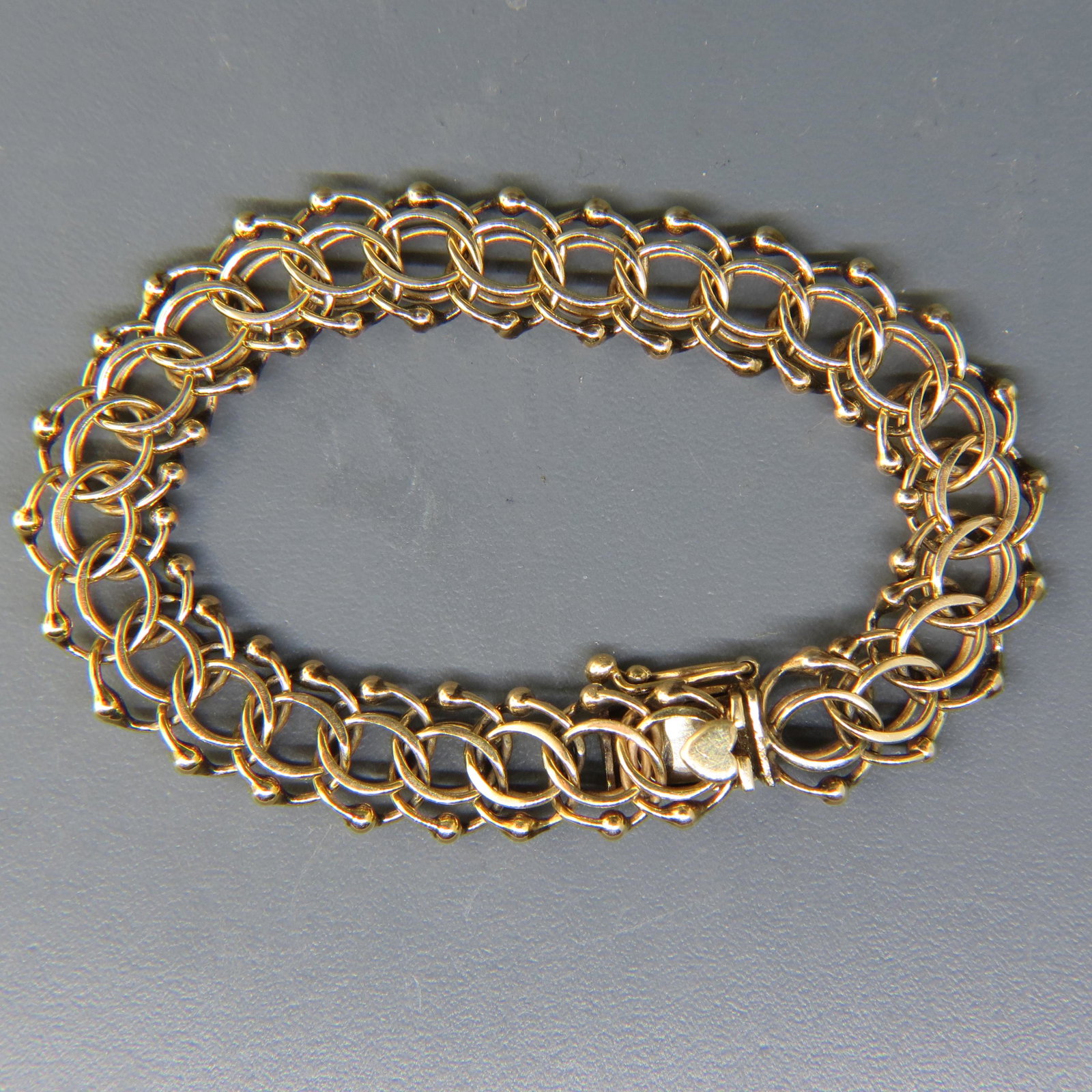 14K Gold Bracelet,: double link & ball style, great for charms, 7" long, 1/2" wide, 21.5 grams.