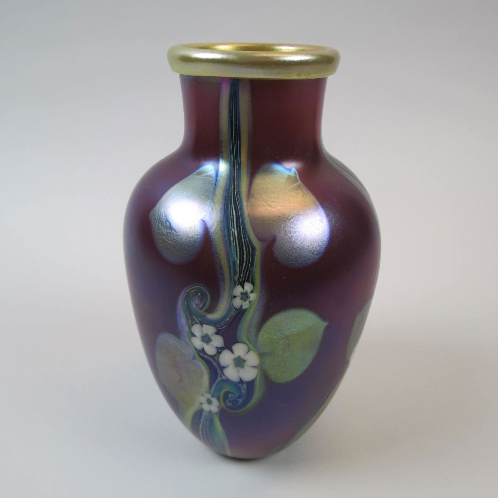 Orient & Flume Art Glass Vase,: flowering vine on iridescent amethyst, golden interior, 8 3/4", signed and dated 1979, excellent...Orient & Flume produces fine art glass for the collector. These signed pieces capture nature's inspir
