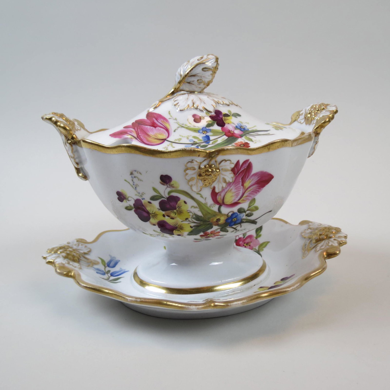 Fine English Porcelain Sauce Tureen,: hand painted floral sprays, gold trim, attached underplate, oval, 5 1/2" X 8", fruit finial, 6" tall, late 19th century.