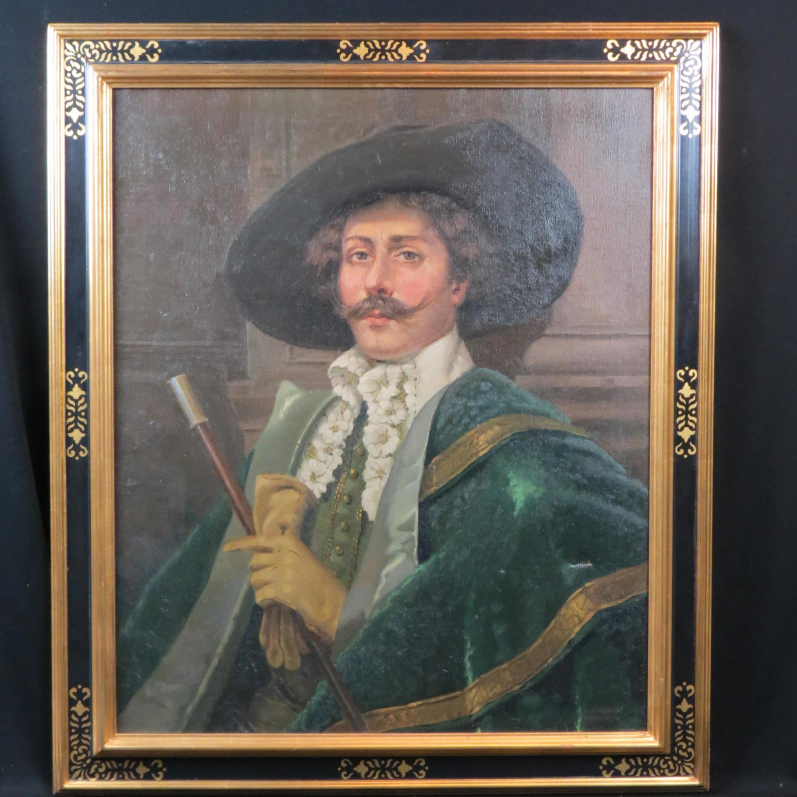Oil Painting of a Cavalier,: with green cape, hat and a walking stick, on canvas, image area 26" X36", plus black and gold frame, signed G.A. Michel.