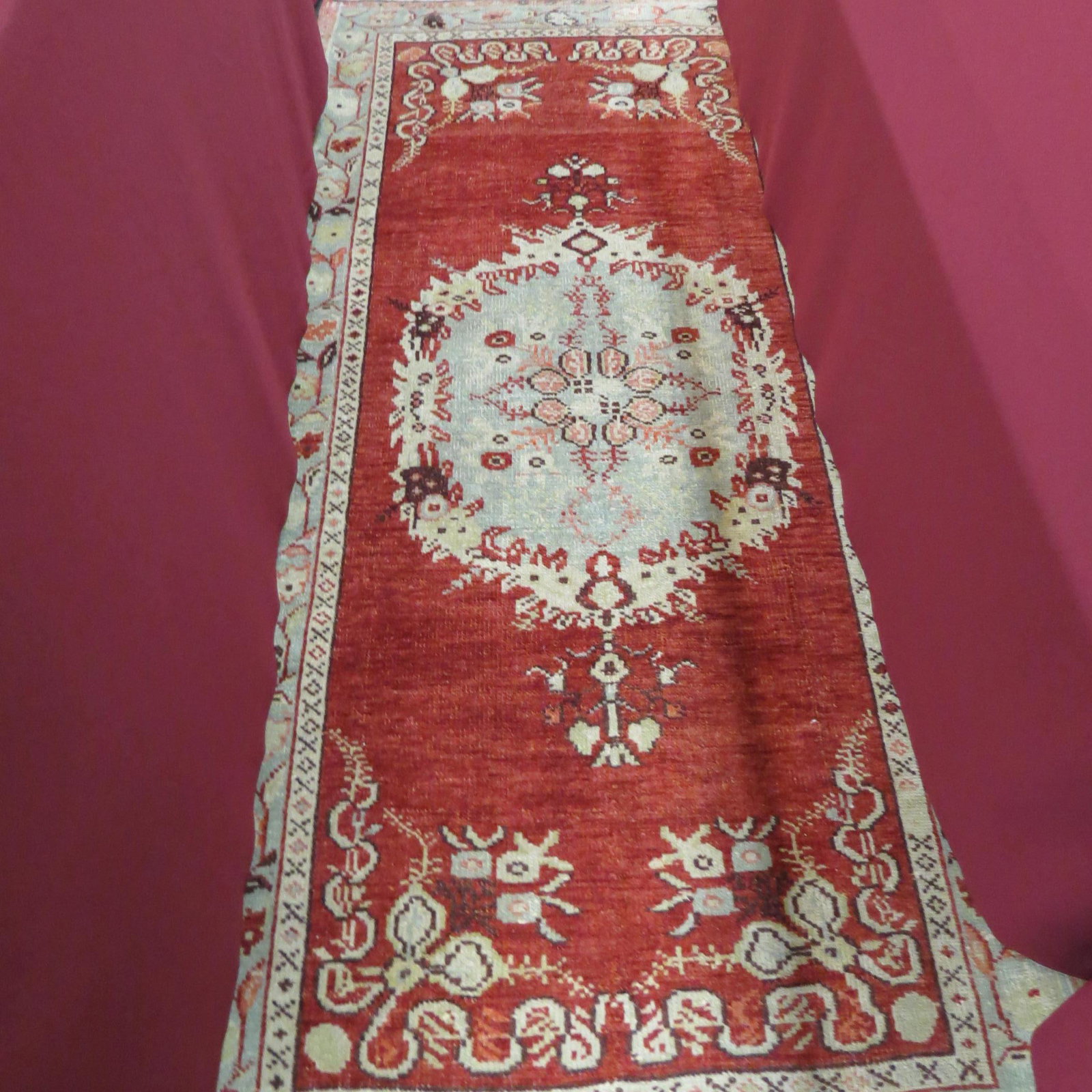 Oushak Turkish Handmade Rug,: floral center on ivory with salmon field, flowers and bow designs in corners, 3'1" X 6'5".