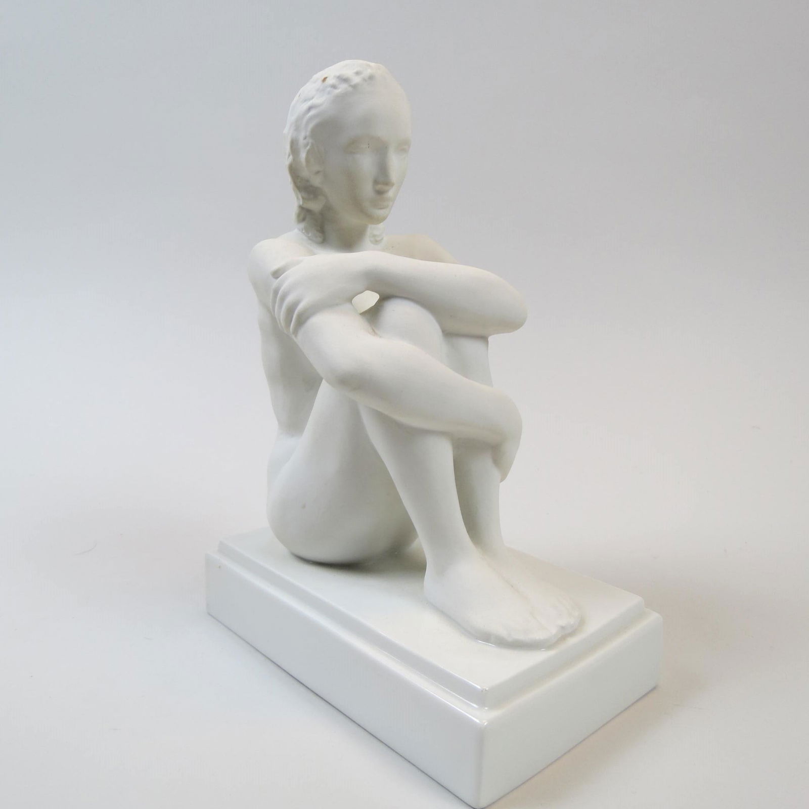 Royal Berlin KPM Porcelain Figurine of Nude Woman,: seated, Art Deco era, 9" tall, excellent.