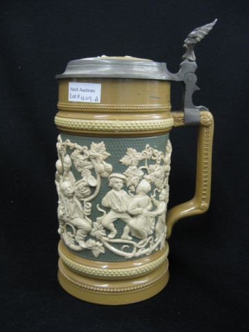 Mettlach Pottery Stein,: festive party scene in relief, inlaid lid, #485, 1 liter, 9 3/4", excellent.