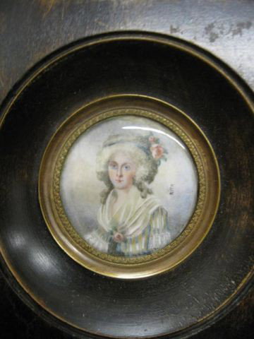 Miniature Portrait on Ivory of Young Lady, artist : artist signed Rita, elaborate flowers, 1 3/4" diameter, in wooden frame, 19th century.
