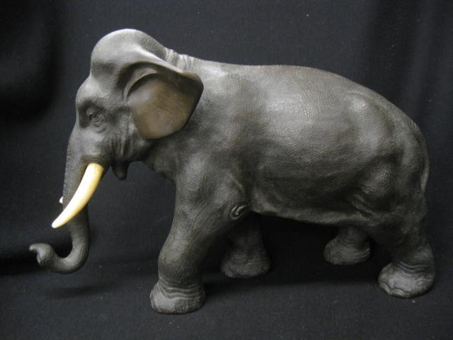 Japanese Bronze Elephant Figurine, Meiji period, i: Meiji period, ivory tusks, signed, 8 1/2" tall, 12 1/2" long, excellent.