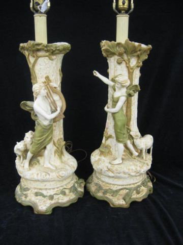 Pair of Royal Dux Figural Porcelain Lamps, boy : boy with harp & lions, girl with lamb, Art Nouveau style, 22" body. ROYAL DUX BOHEMIA PORCELAIN MANUFACTURING COMPANY LOCATED IN THE CZECH REPUBLIC, HAS BEEN IN OPERATION FOR MANUFACTURING BOHEMIAN PO