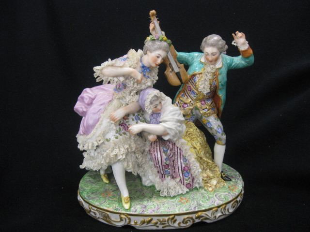 Dresden Porcelain Group Figurine of Violin player : Violin player and two women, face applied lacework & flowers, excellent handpainted detail, 9 1/2" tall, circa 1910.