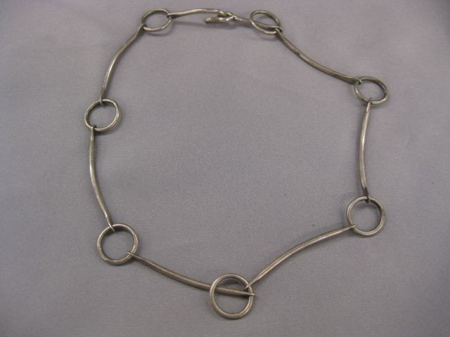 Sterling Silver Necklace by Winfred Clark Shaw, : by Winfred Clark Shaw, 16" long, exhibited. Winifred Clark Shaw was an accomplished artisan and a highly regarded UNH professor, who taught jewelry, metalsmithing, and weaving here from 1954 to 1987. 