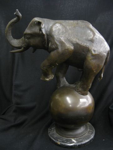 Bronze Statue of an Elephant with a Ball, 22 3/4": 22 3/4" tall, black marble base.