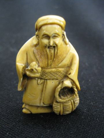 Carved Ivory Netsuke of an Old Man, with basket,: with basket, 1 7/8", excellent.