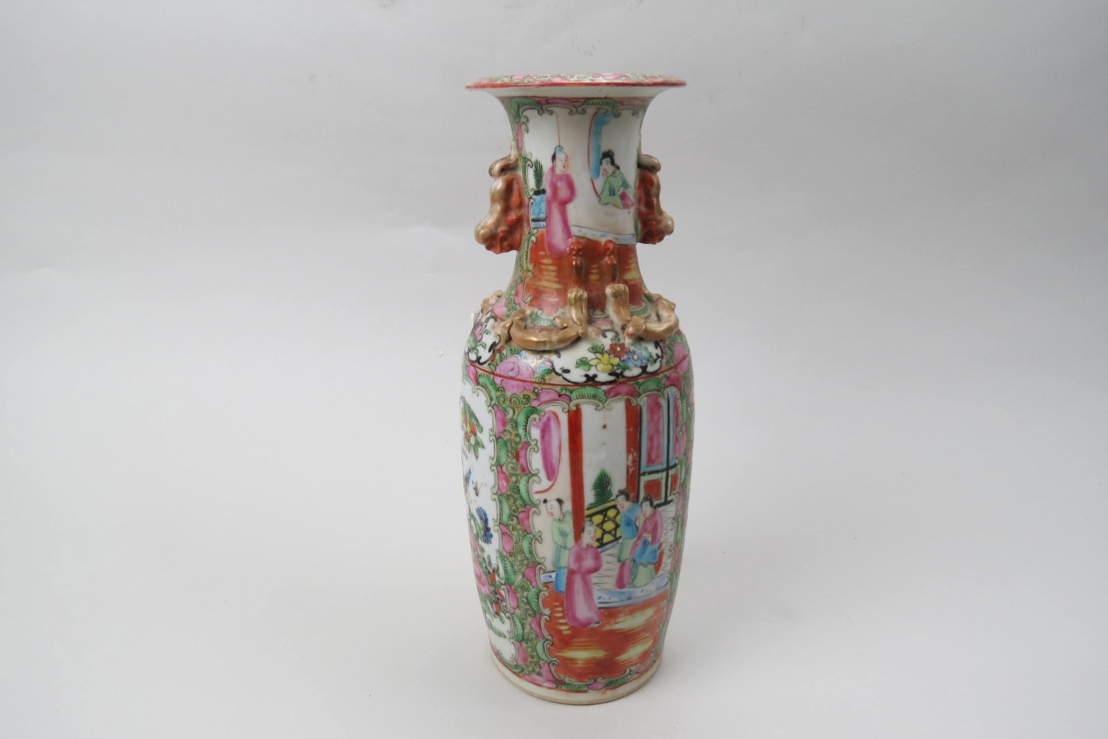Chinese Rose Medallion Porcelain Vase,: foo dog handles, creatures near neck, scenes of villagers alternation with birds and flowers, 12", drilled to use as a lamp base.