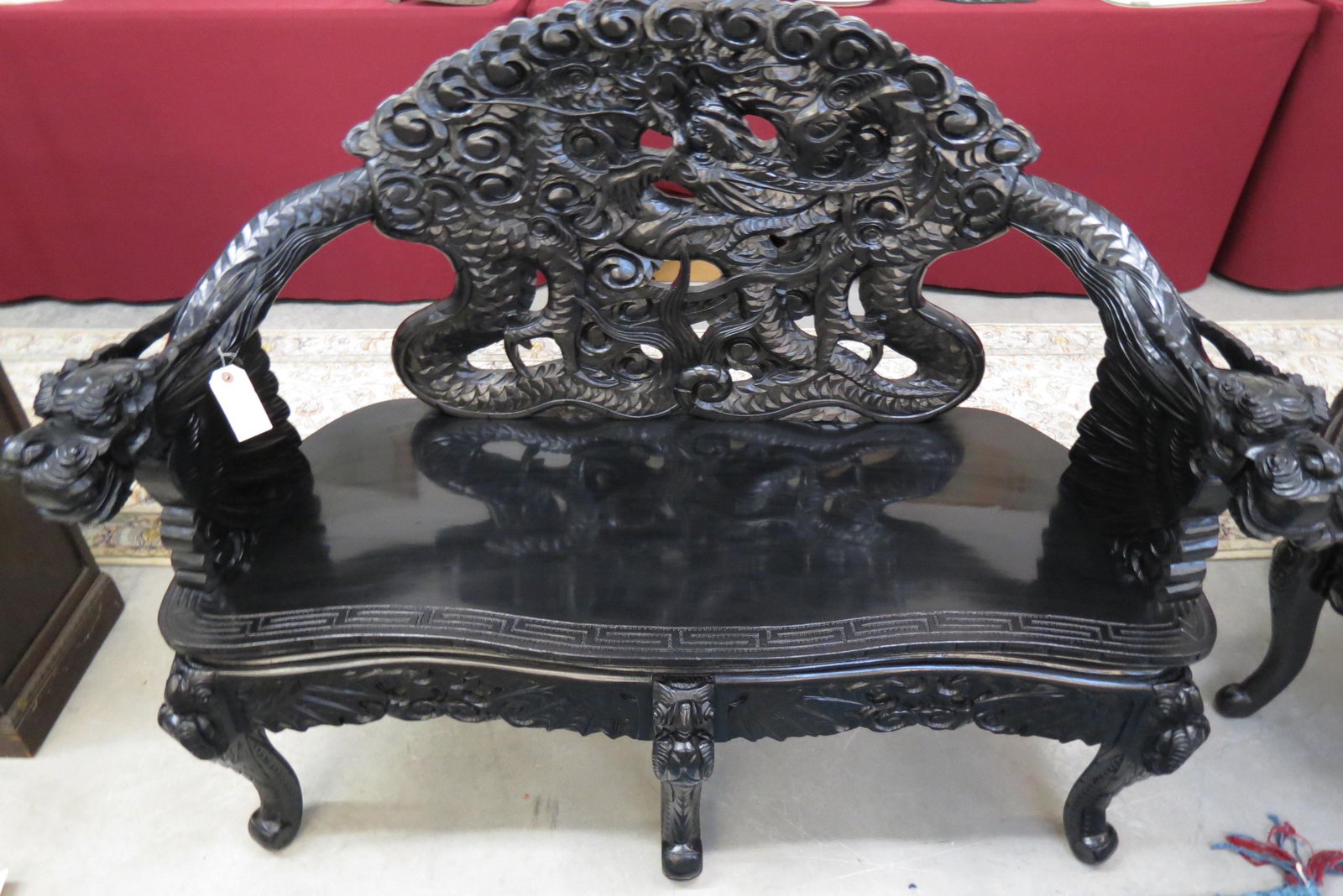 Chinese Carved Sofa or Loveseat,: elaborate dragon decor, black finish, circa 1920's, 51" wide, 40" tall, 22" deep, excellent.