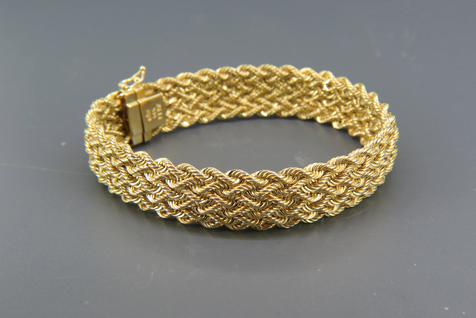 14K Gold Bracelet,: braided six rope style design, over 1/2" wide, 7 1/2" long, 12.5 grams, excellent.