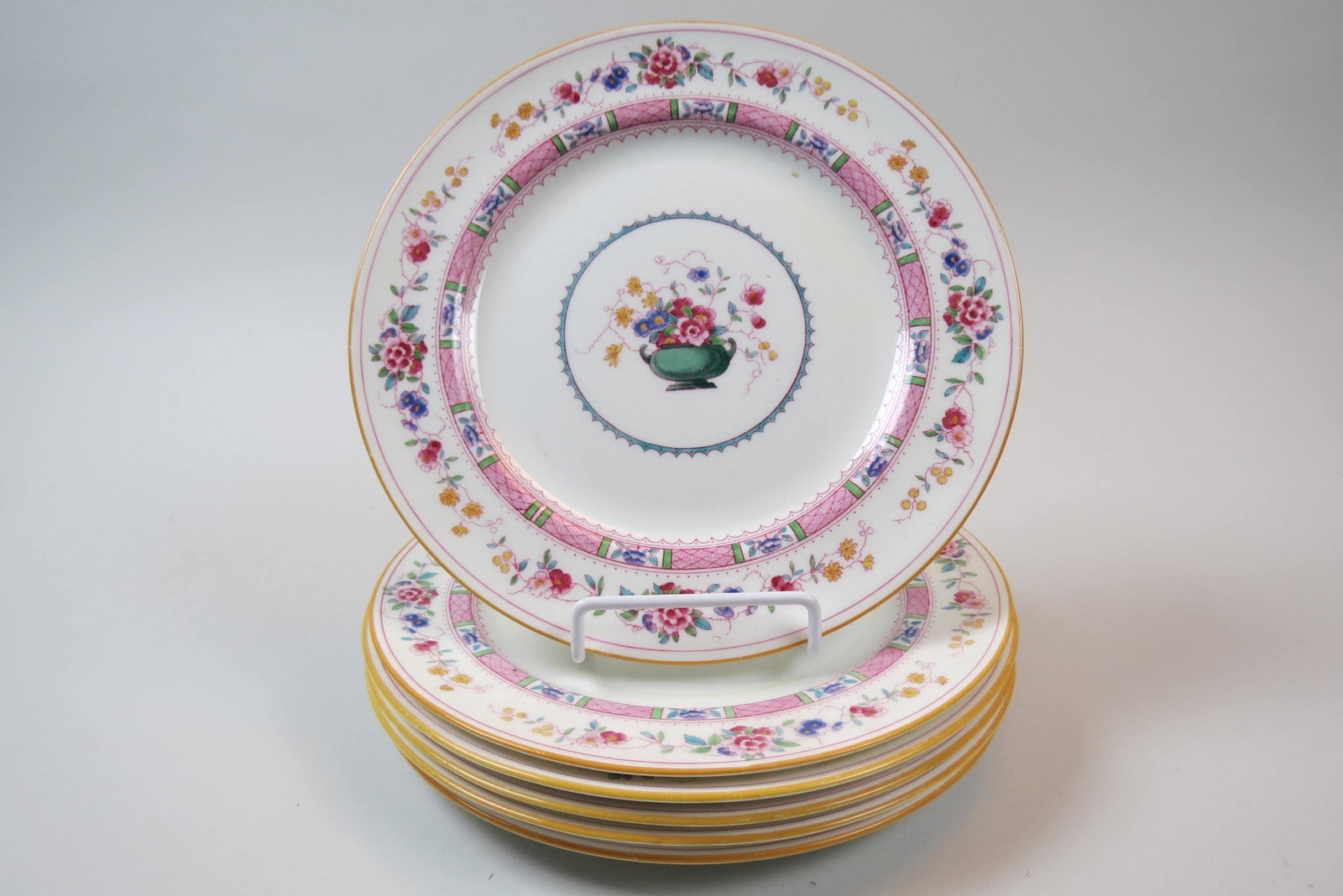 6 Royal Doulton China Plates,: enameled center medallion with flowers in vase, floral garland and banded trim, yellow rim, E-4630, 10 1/4".