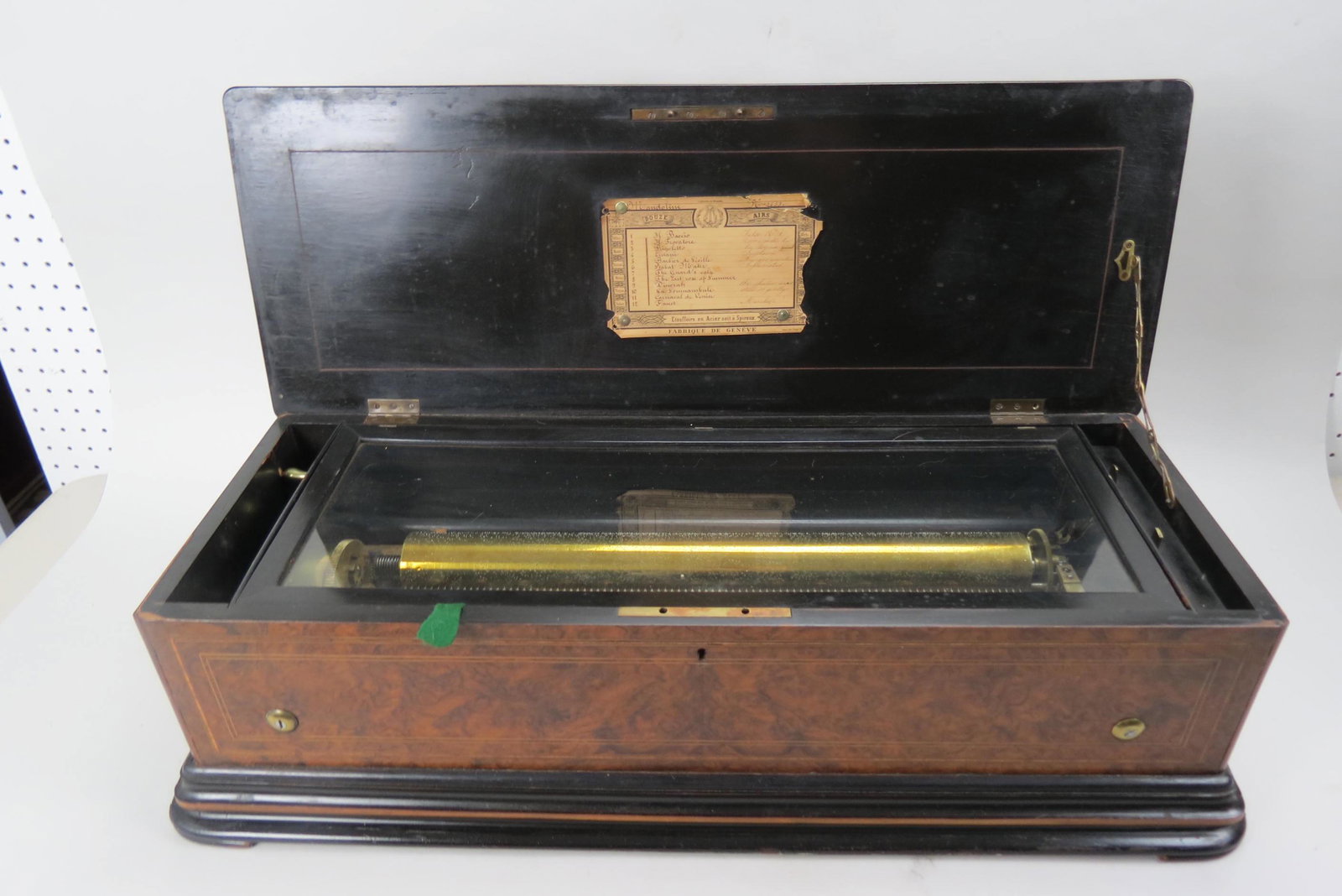 Victorian Swiss Cylinder Musuc Box, 12 tunes,: with a 19 1/4" cylinder, burl and inlaid case, 30" wide, 9" tall, 12" deep, working.
