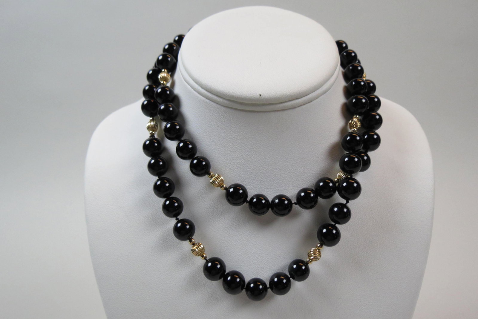 14K Gold & Black Onyx Necklace,: onyx and yellow gold beads, 32" long.