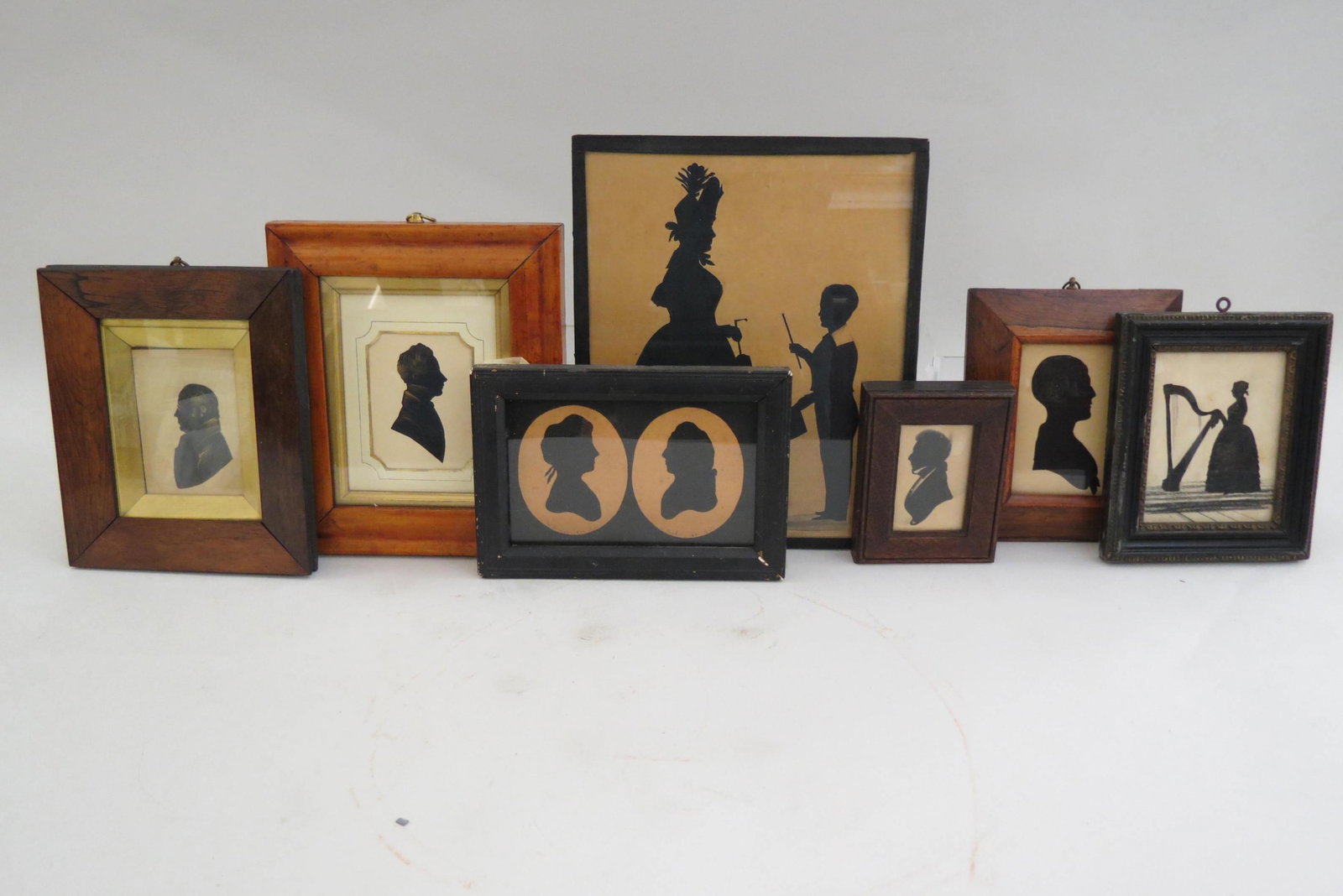 7 Silhouttes,: includes lady with harp, couple and more, largest is 9" X 11".