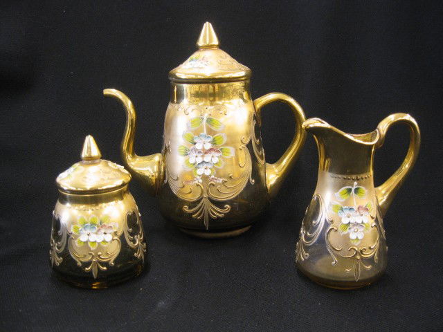 3 pc. Italian Art Glass Tea Set, raised enamel flow: raised enamel flowers on heavy gold work, topaz glass, includes 6 1/2" teapot, creamer & sugar, excellent.