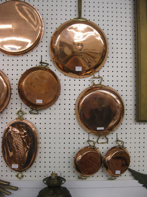 6 Copper Pans, round and an oval, some signed, lar: round and an oval, some signed, largest is 12" diameter, all recently polished.