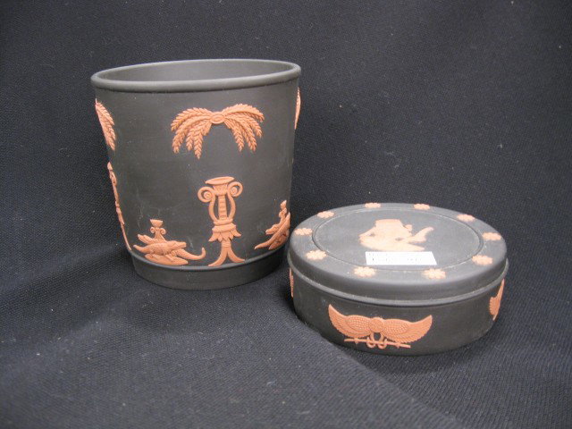 2 pcs. Wedgwood Jasperware, "Egyptian" powder box: "Egyptian" powder box and 4 1/2" planter with alligator, unusual cinnamon on black, excellent. You could say that pottery was in Josiah Wedgwood's blood. Wedgwood (1730-1795) was the 12th child of pot