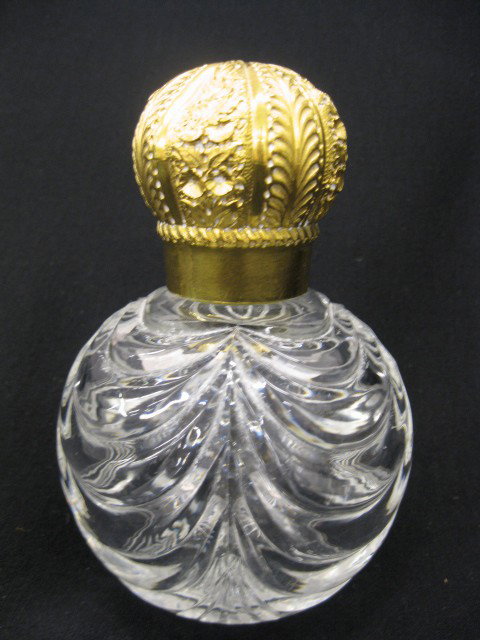 Victorian Cut Crystal & Bronze Perfume Bottle, do: dore finish on elaborate screw off top, drapery cut crystal, attributed to Baccarat, 6" tall, 4" diameter, excellent.