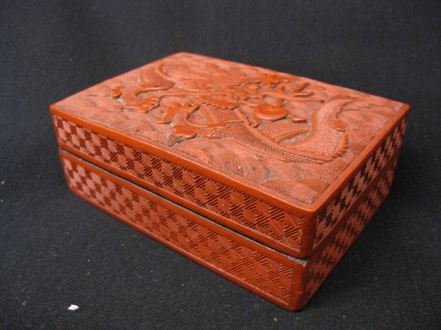 Chinese Cinnabar Box with dragon, 3 5/8" x 5 1/4": Cinnabar is the popular name used to describe Chinese lacquerware of a striking red color known for many centuries. When first produced, the distinctive color was derived from a mineral known as cinna