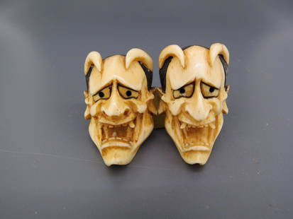 Pair of Carved Japanese Devil's Head Earrings,: mask type, currently with gold-filled clip earrings on back.