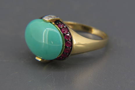 Turquiose, Ruby & Diamond Ring by LeVian,: rich oval cabochon turquoise surrounded by 16 round rubies totaling .75 carat and 4 round diamonds totaling .04 carat, 14K yellow gold, signed, with appraisal of $1,750.00, currently size 7 1/4.