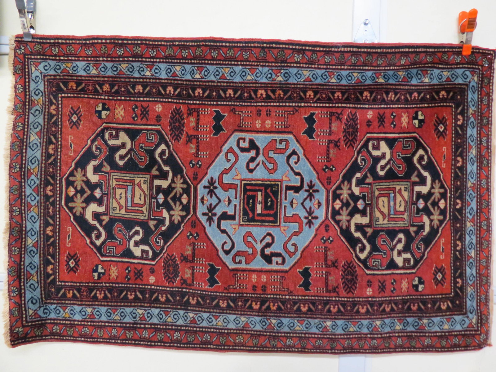 Antique Persian Handmade Rug,: a trio of octagon shape medallions with cloud band designs, salmon field, multi-border, 2'7" X 4'1".