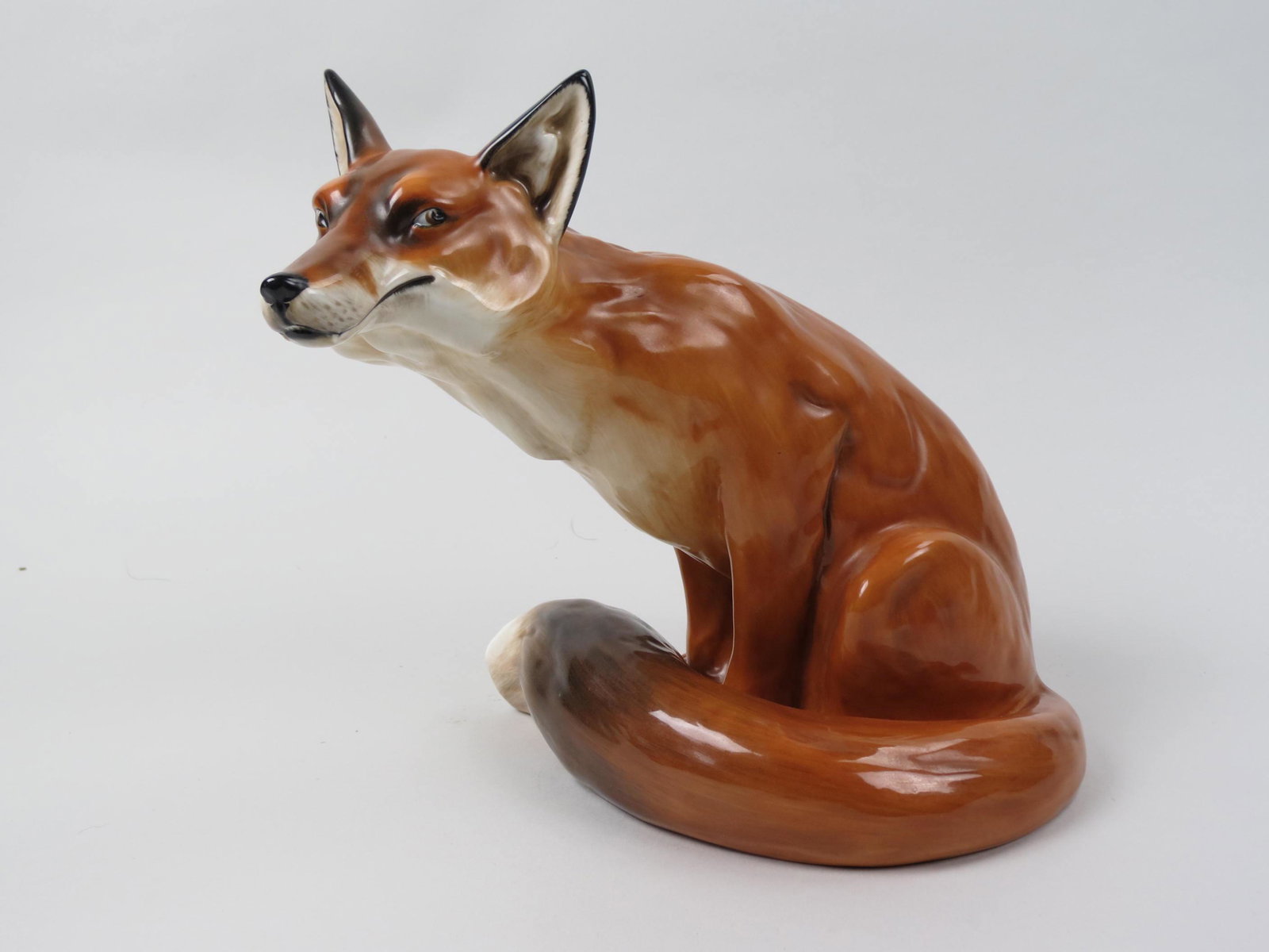 Royal Doulton Figurine "Prestige Fox",: HN2634, 13-10-80, 10" tall, excellent.....Royal Doulton is famous for the lustrous red glaze known as flambe. Inspired by Oriental glazes, Doulton's flambe made it's debut at the St Louis exhibition o