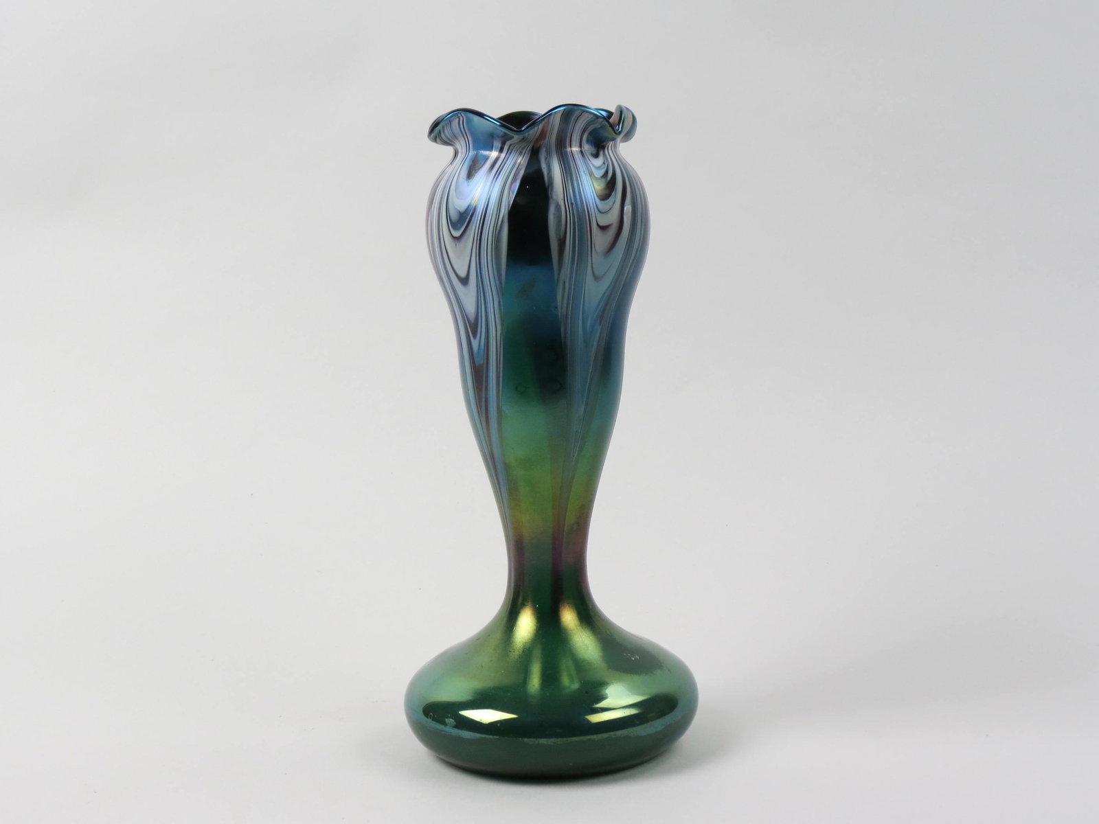 Loetz Art Glass Vase,: amethyst and white drapery effect on iridescent green, floraform shape, 11" tall, signed, museum deaccession numbers, excellent.
