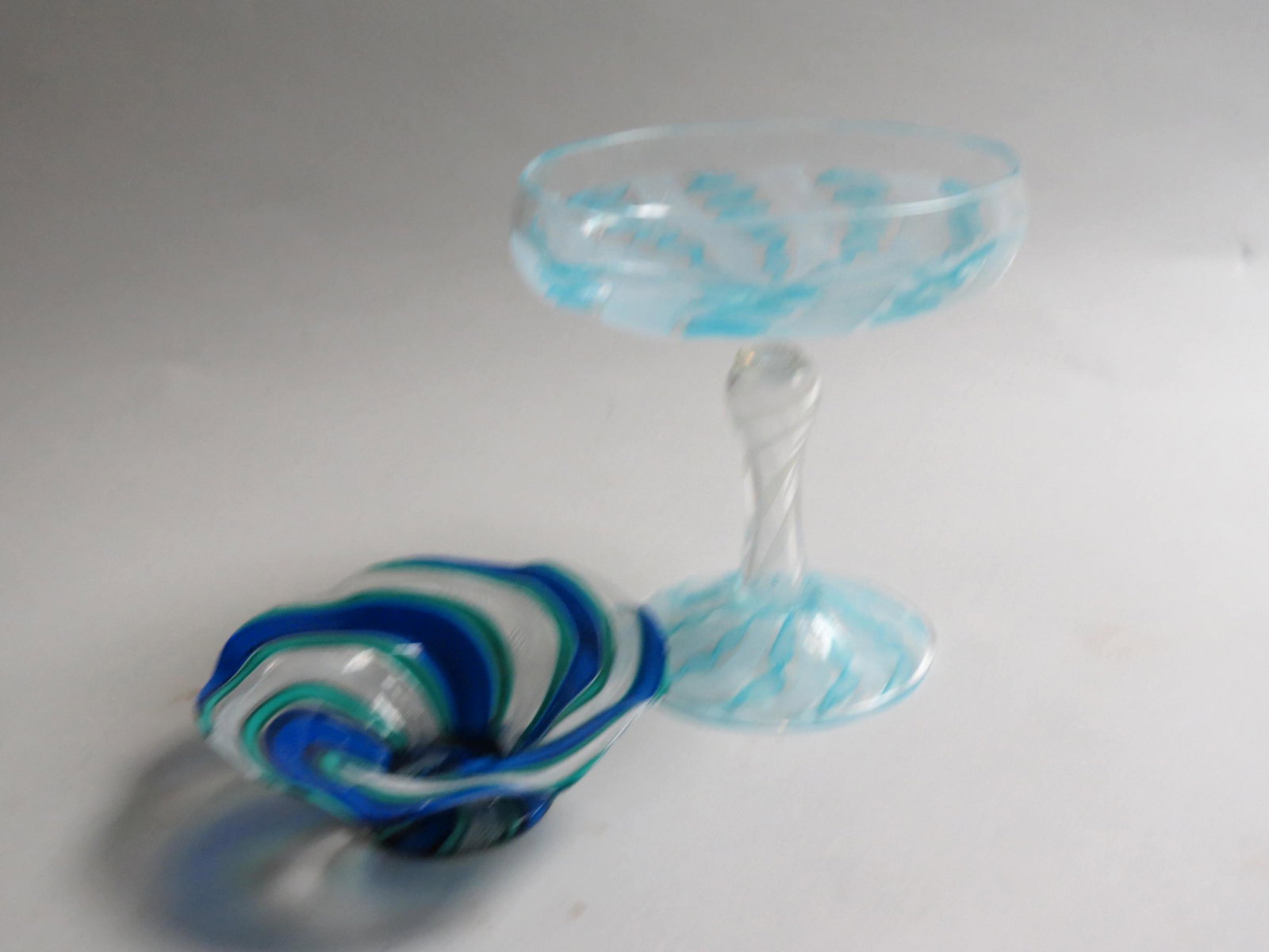 2 pcs. Ribbon & Latticino Art Glass,: a 6" tall compote with blue and white internal work, signed, and a blue, green and white 4" diameter dish, both excellent