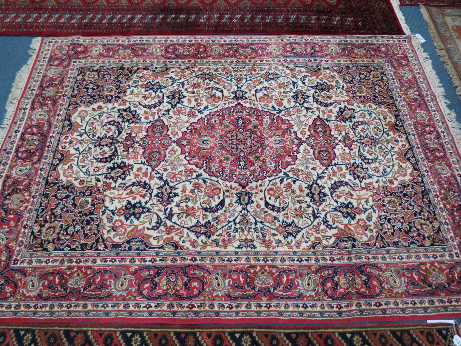 Persian Handmade Rug,: elaborate flowering vine design on ivory field, multi-border, 6' X 9'.