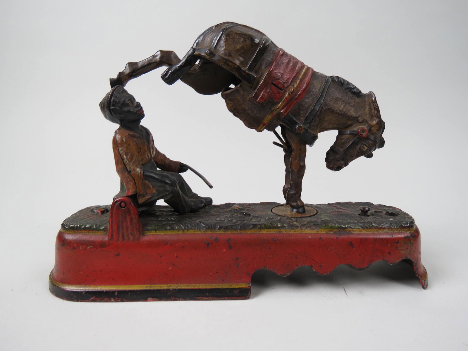 Antique Cast Iron Mechanical Bank "Always Did: Spize a Mule", original paint, pat'd April 12, 1897, 6 1/2" tall, 10" long, currently not operating, missing coin cover underneath and lacks on leg (broken) on the mule.