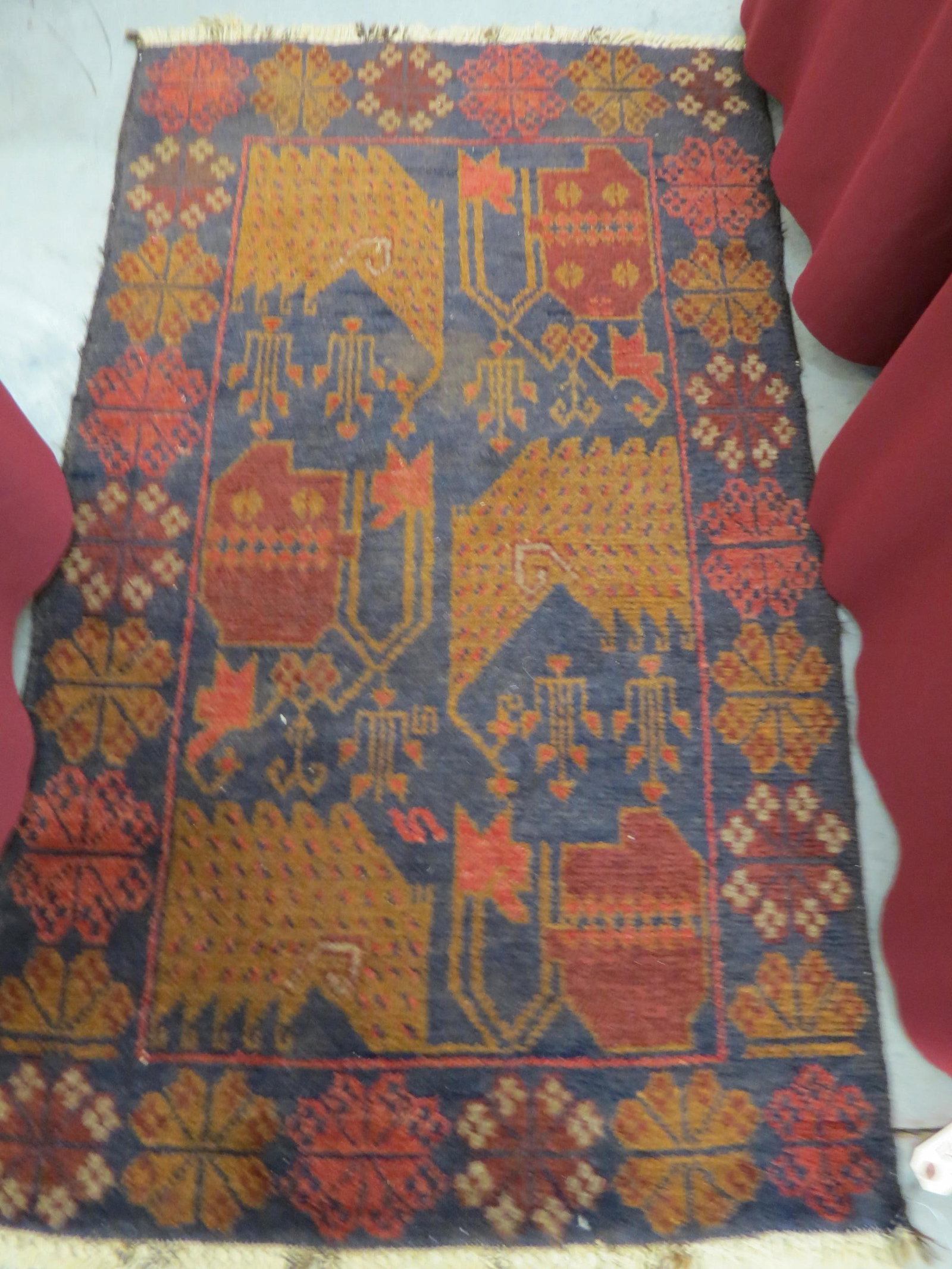 Persian Handmade Rug,: geometric designs with dark reds and browns on indigio field, 2'9" X 4'8".